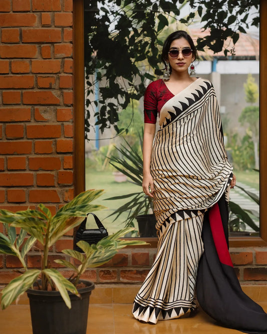 BEAUTIFULL CREAM STRIPTED SAREE WITH RED BINDI PALLU.